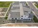 Overhead view of a white stucco home with a gray roof and meticulously landscaped yard at 2779 E Derringer Way, Gilbert, AZ 85295