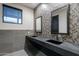 Modern bathroom featuring dual sinks, stylish tile work, and a sleek, contemporary design at 2779 E Derringer Way, Gilbert, AZ 85295