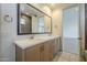 Bathroom featuring a double sink vanity, a large mirror, and tiled floors at 2779 E Derringer Way, Gilbert, AZ 85295