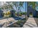 Community entrance with tree and landscaping. View of community buildings at 2779 E Derringer Way, Gilbert, AZ 85295