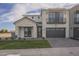 Charming two-story home with brick accents, a two-car garage, and well-maintained landscaping at 2779 E Derringer Way, Gilbert, AZ 85295