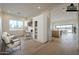 Virtually staged home office with built-in shelving, desk space, and two comfortable chairs at 2779 E Derringer Way, Gilbert, AZ 85295