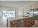 Open concept kitchen with stainless steel dishwasher and view of great room at 2779 E Derringer Way, Gilbert, AZ 85295