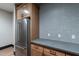 Kitchenette featuring stainless steel appliances, wood cabinets, and mosaic backsplash at 2779 E Derringer Way, Gilbert, AZ 85295