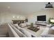 Spacious living room area featuring a pool table and seating, virtually staged at 2779 E Derringer Way, Gilbert, AZ 85295