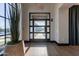 Modern building lobby with sleek door, ample sunlight, and elegant plant decor at 2779 E Derringer Way, Gilbert, AZ 85295