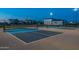 Lit pickleball courts offer recreational opportunities in this active community during twilight at 2779 E Derringer Way, Gilbert, AZ 85295