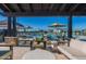 Relaxing community pool area with comfortable seating under shaded pergola, perfect for outdoor lounging at 2779 E Derringer Way, Gilbert, AZ 85295