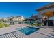 Inviting community pool area with splash pad, lounge chairs and outdoor seating for relaxation at 2779 E Derringer Way, Gilbert, AZ 85295