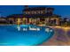 Relaxing community pool with steps into the water under the twilight sky at 2779 E Derringer Way, Gilbert, AZ 85295