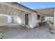 The exterior of the home features a convenient carport and a beautifully bricked walkway to the front door at 303 W Hazelwood St, Phoenix, AZ 85013