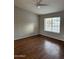 Bright bedroom with laminate flooring, neutral walls and a ceiling fan at 304 E Madison St, Avondale, AZ 85323