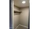 Walk-in closet includes a top hanging bar for optimal storage at 304 E Madison St, Avondale, AZ 85323