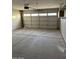 Spacious garage with a functional garage door and smooth concrete flooring at 304 E Madison St, Avondale, AZ 85323