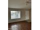 Freshly painted living room with laminate flooring and neutral walls at 304 E Madison St, Avondale, AZ 85323