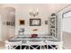 Charming dining area with elegant chandelier, table with runner, and decorative display cabinet at 320 W Phantom Dr, Casa Grande, AZ 85122