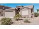 Charming single-story home featuring a two-car garage and low-maintenance desert landscaping at 320 W Phantom Dr, Casa Grande, AZ 85122