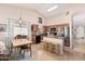 Bright kitchen with stainless steel appliances, wood cabinetry, and an adjacent dining area at 320 W Phantom Dr, Casa Grande, AZ 85122