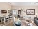 Open-concept living area showcasing a dining table, seating area, and decorative accents at 320 W Phantom Dr, Casa Grande, AZ 85122