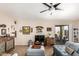 Inviting living room with sliding doors, a ceiling fan, and stylish furniture at 320 W Phantom Dr, Casa Grande, AZ 85122