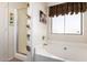 Bright bathroom showcasing a tub, glass enclosed shower and white walls at 320 W Phantom Dr, Casa Grande, AZ 85122