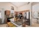 Kitchen with stainless steel appliances, dark countertops, and wooden cabinets at 320 W Phantom Dr, Casa Grande, AZ 85122