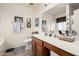 Well lit bathroom featuring framed art, neutral paint, and solid surface counter at 320 W Phantom Dr, Casa Grande, AZ 85122