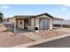 Single-story home with carport, xeriscape landscaping, and covered patio at 3330 E Main St # 250, Mesa, AZ 85213