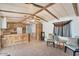 Living room featuring wood beams, ceiling fan, and cozy seating area with natural light at 3330 E Main St # 250, Mesa, AZ 85213