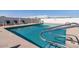 Enjoy the community's shimmering blue pool surrounded by lounge chairs and privacy fence at 3330 E Main St # 250, Mesa, AZ 85213