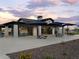 Exterior of the community clubhouse with covered patios and outdoor seating areas at 3492 E Audrey Dr, San Tan Valley, AZ 85143