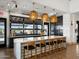 Contemporary kitchen with marble counters, stylish pendant lighting, and sleek black cabinetry at 3492 E Audrey Dr, San Tan Valley, AZ 85143