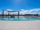 Community pool featuring a splash pad, lounge chairs, shade structures and light blue water at 3492 E Audrey Dr, San Tan Valley, AZ 85143