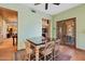 This dining room has decorative doors and is equipped with a beautiful table and chairs at 3756 N Rock Wren Ct, Buckeye, AZ 85396