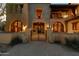 Stately gated entrance with manicured landscaping and mosaic planters at 3756 N Rock Wren Ct, Buckeye, AZ 85396