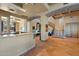 Grand foyer with stone floors, arched doorways, wrought iron staircase, and custom architectural details at 3756 N Rock Wren Ct, Buckeye, AZ 85396