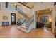 Grand foyer with a staircase that has decorative ironwork and tile landings at 3756 N Rock Wren Ct, Buckeye, AZ 85396