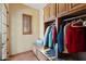 Mudroom with granite bench seating and custom cabinets for organized storage at 3756 N Rock Wren Ct, Buckeye, AZ 85396