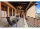 Outdoor patio space with seating area and red framed window at 3756 N Rock Wren Ct, Buckeye, AZ 85396