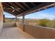 Covered patio with a ceiling fan and mountain views at 3756 N Rock Wren Ct, Buckeye, AZ 85396