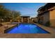 Resort-style pool and spa with a cozy cabana in the backyard at 3756 N Rock Wren Ct, Buckeye, AZ 85396