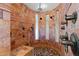 Walk-in shower with beautiful stone tile and multiple shower heads at 3756 N Rock Wren Ct, Buckeye, AZ 85396