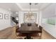 Bright dining room features a chandelier and seating for ten at 3760 E Cotton Ct, Gilbert, AZ 85234