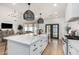 Gourmet kitchen with an open-concept design flowing to living room at 3760 E Cotton Ct, Gilbert, AZ 85234