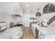 Modern kitchen with a large center island and white tile backsplash at 3760 E Cotton Ct, Gilbert, AZ 85234