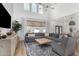 Inviting living room with gray sofa and natural light at 3760 E Cotton Ct, Gilbert, AZ 85234