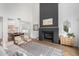 Bright living room featuring a modern fireplace and hardwood floors at 3760 E Cotton Ct, Gilbert, AZ 85234