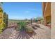 Landscaped backyard with desert plants, patio, and desert views at 41225 N River Bend Rd, Phoenix, AZ 85086