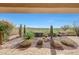 View from covered patio to golf course and mountains at 41225 N River Bend Rd, Phoenix, AZ 85086