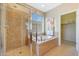 Bathroom featuring a soaking tub and shower combination with tile floors and vanity at 41225 N River Bend Rd, Phoenix, AZ 85086